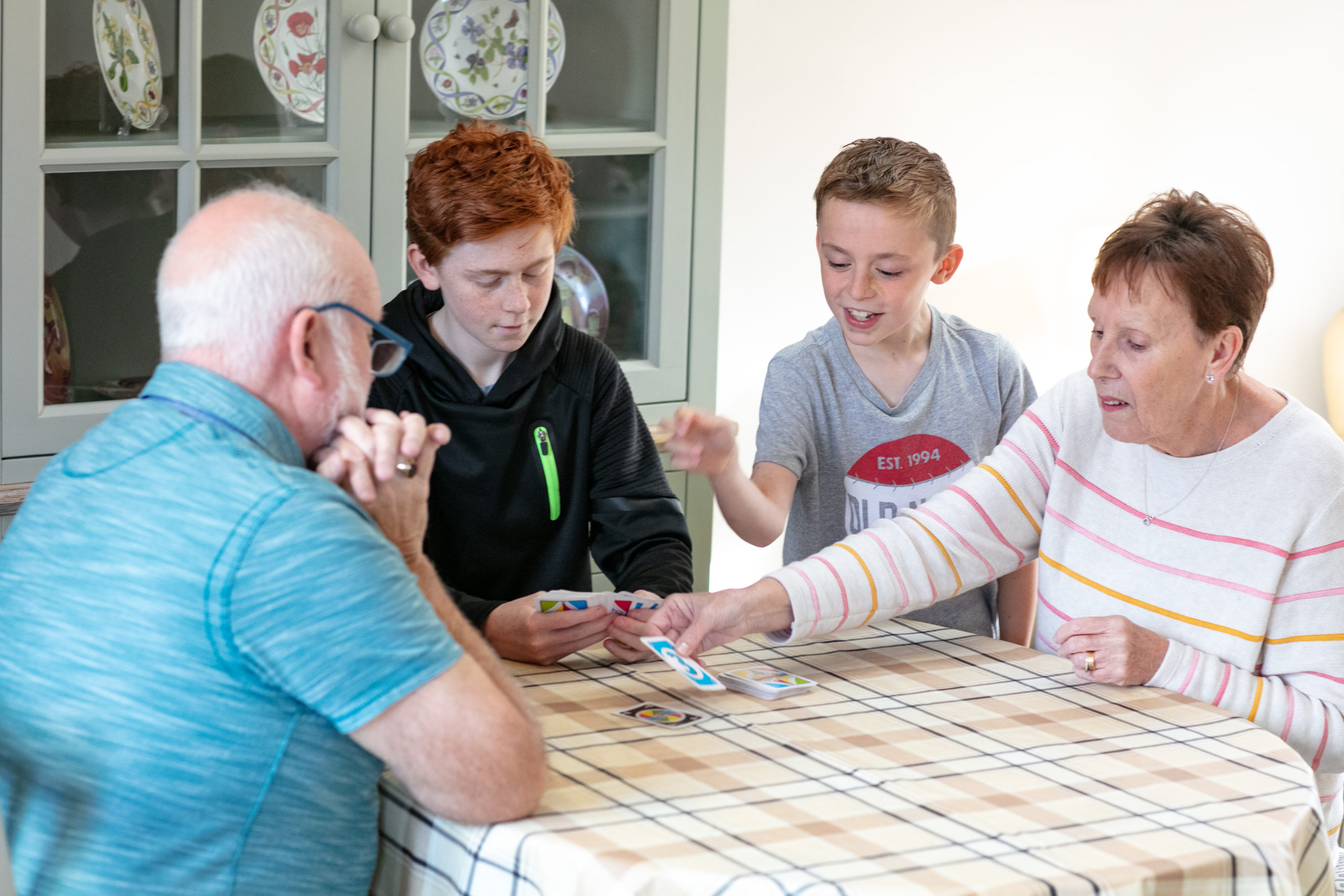Family playing games at table