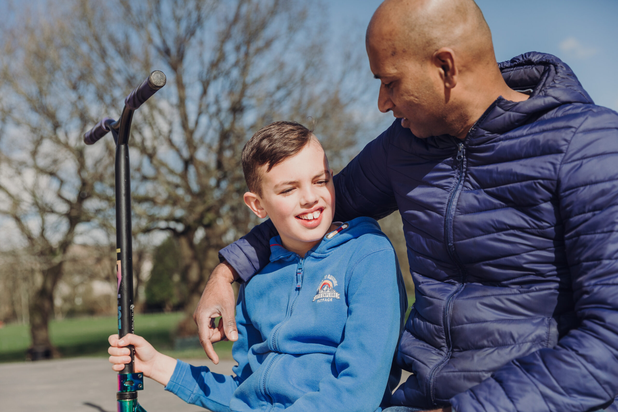 boy and man at a skate park